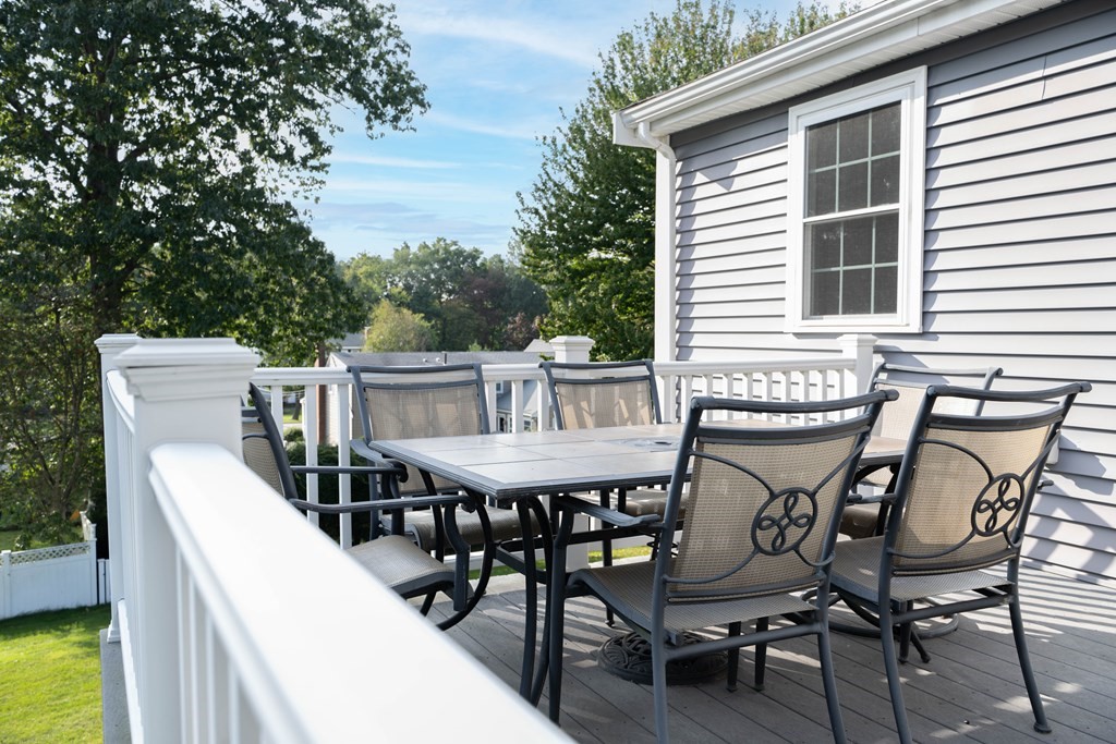 6 Old Meadow Lane Canton, MA 02021 - Photo 29 of 35 a view of a patio with table and chairs