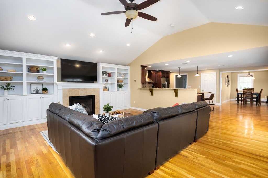 6 Old Meadow Lane Canton, MA 02021 - Photo 7 of 35 a living room with fireplace furniture and a flat screen tv