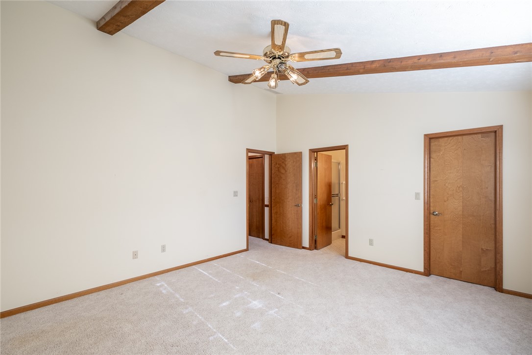 276 South Fairfield Road Bellbrook, OH 45305 - Photo 25 of 38 This spacious bedroom offers exposed beam ceilings and soft carpet underfoot.