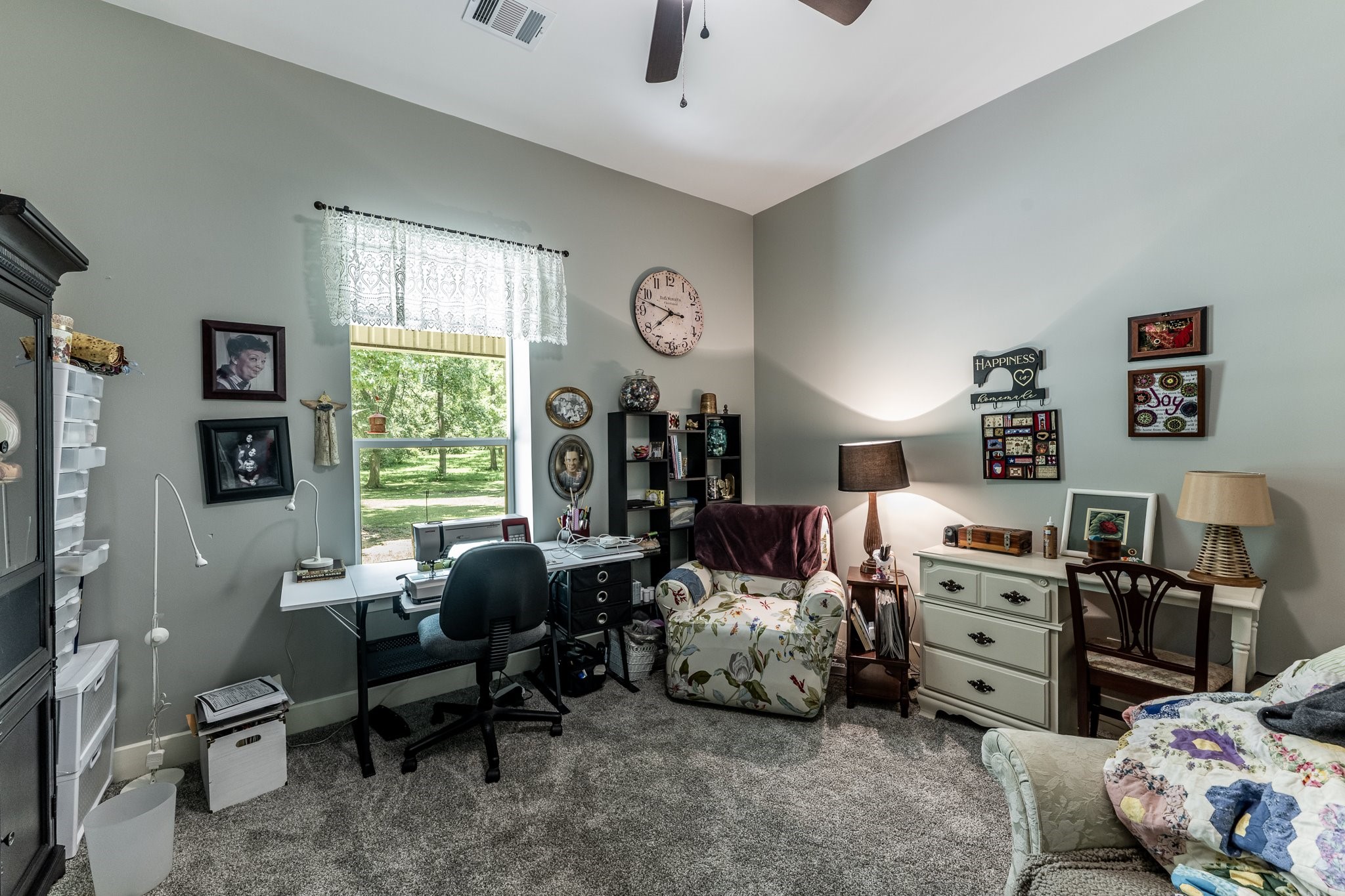 13334 Fultz Road Conroe, TX 77304 - Photo 22 of 49 Bathed in natural light from a large window, this flexible bedroom offers a bright, inspiring space for guests, hobbies, or quiet retreat.