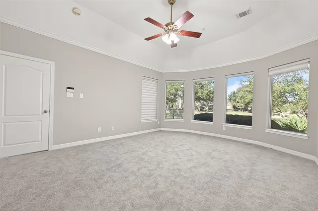 a view of an empty room with a window