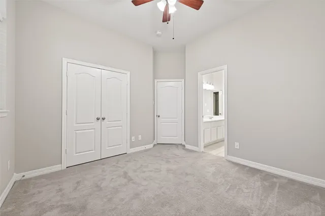 a bathroom with a sink double vanity mirror and a bathtub