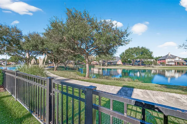 an aerial view of residential house with outdoor space and swimming pool