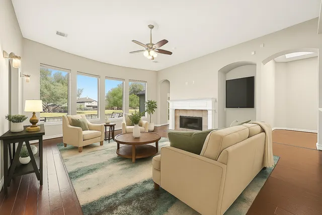 a living room with furniture fireplace and a flat screen tv