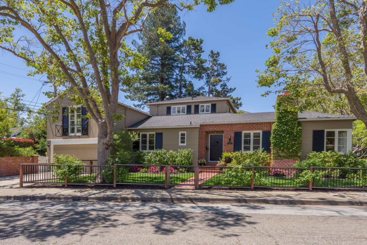 1000 Harvard Road San Mateo, CA 94402 - Photo 1 of 32 a front view of a house with a garden and trees