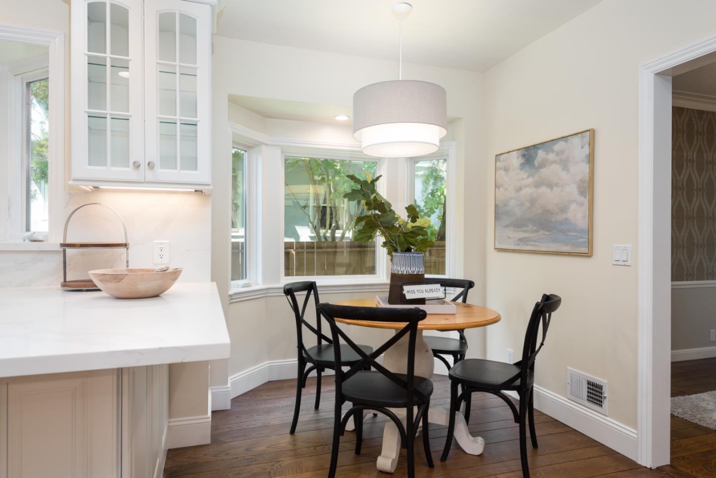 1000 Harvard Road San Mateo, CA 94402 - Photo 11 of 32 a view of a dining room with furniture and a chandelier