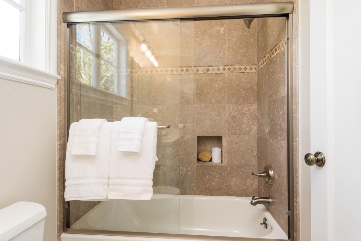 1000 Harvard Road San Mateo, CA 94402 - Photo 22 of 32 a bathroom with a bathtub and a shower