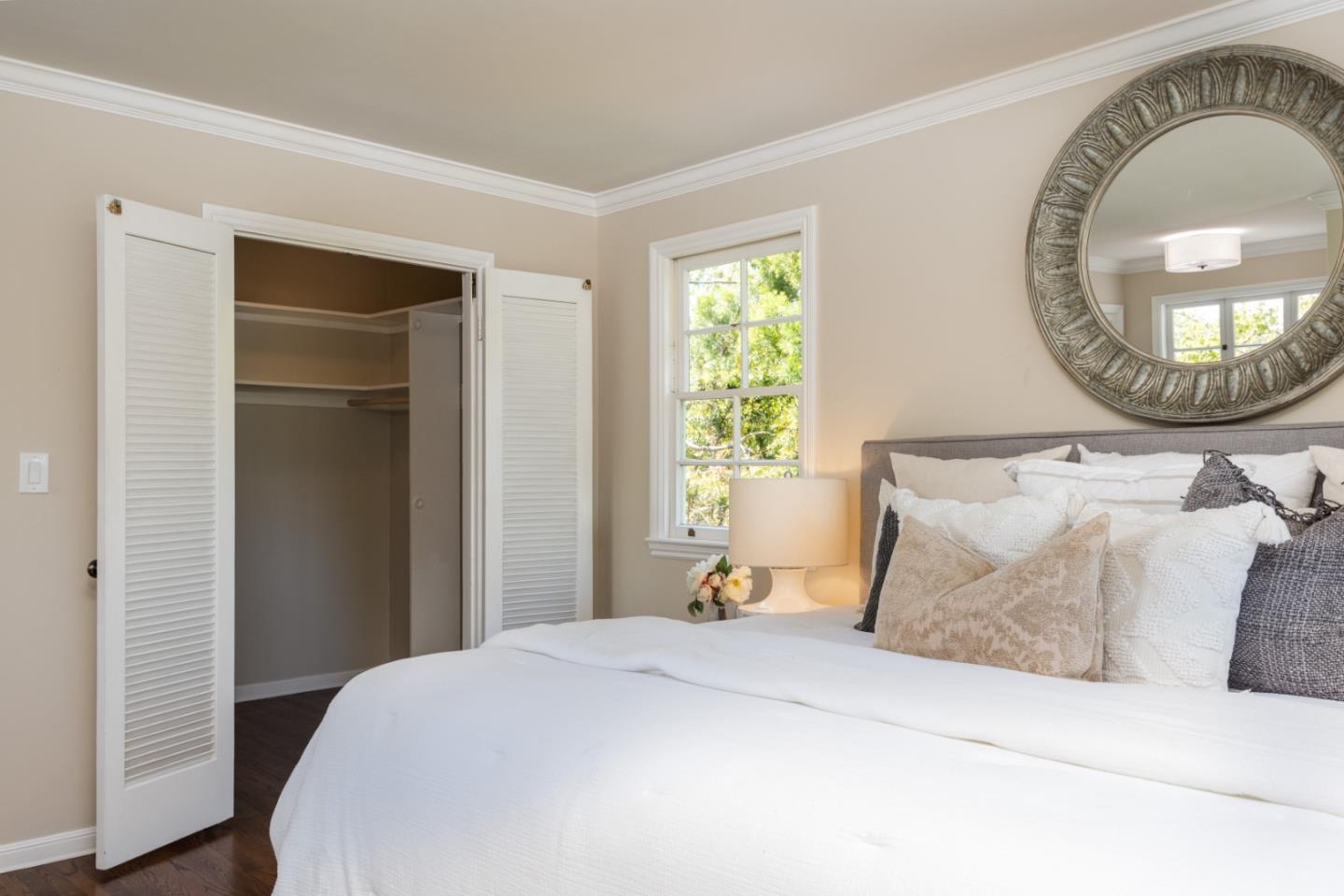 1000 Harvard Road San Mateo, CA 94402 - Photo 23 of 32 a bedroom with a bed and a mirror