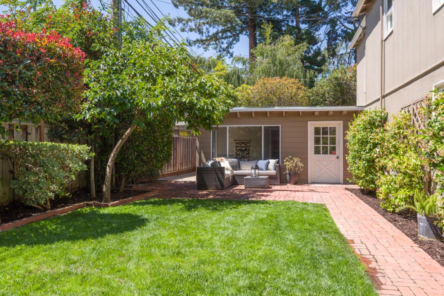 1000 Harvard Road San Mateo, CA 94402 - Photo 28 of 32 a view of a chair and table in backyard of the house