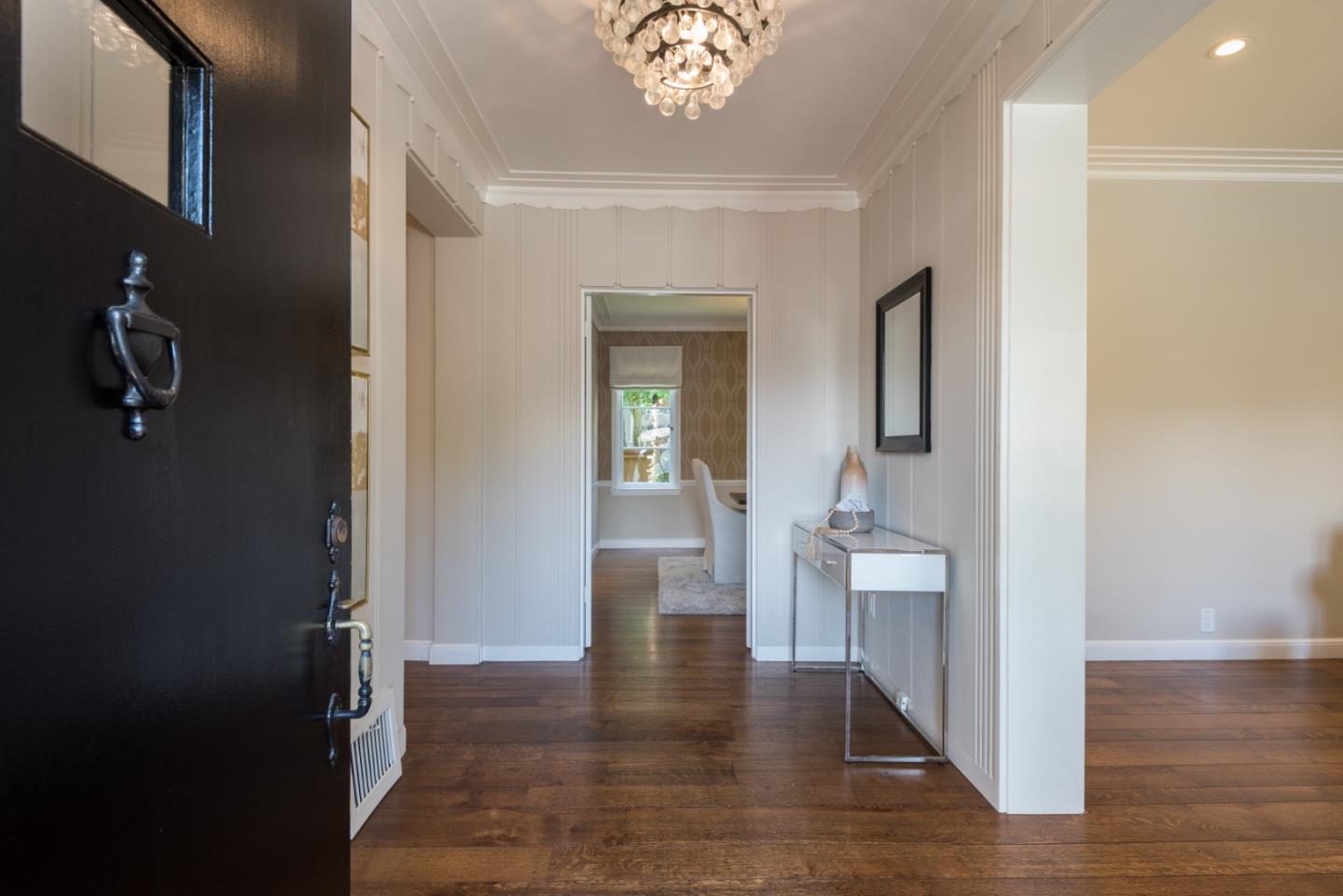 1000 Harvard Road San Mateo, CA 94402 - Photo 3 of 32 a hallway with wooden floor chandelier and livingroom view