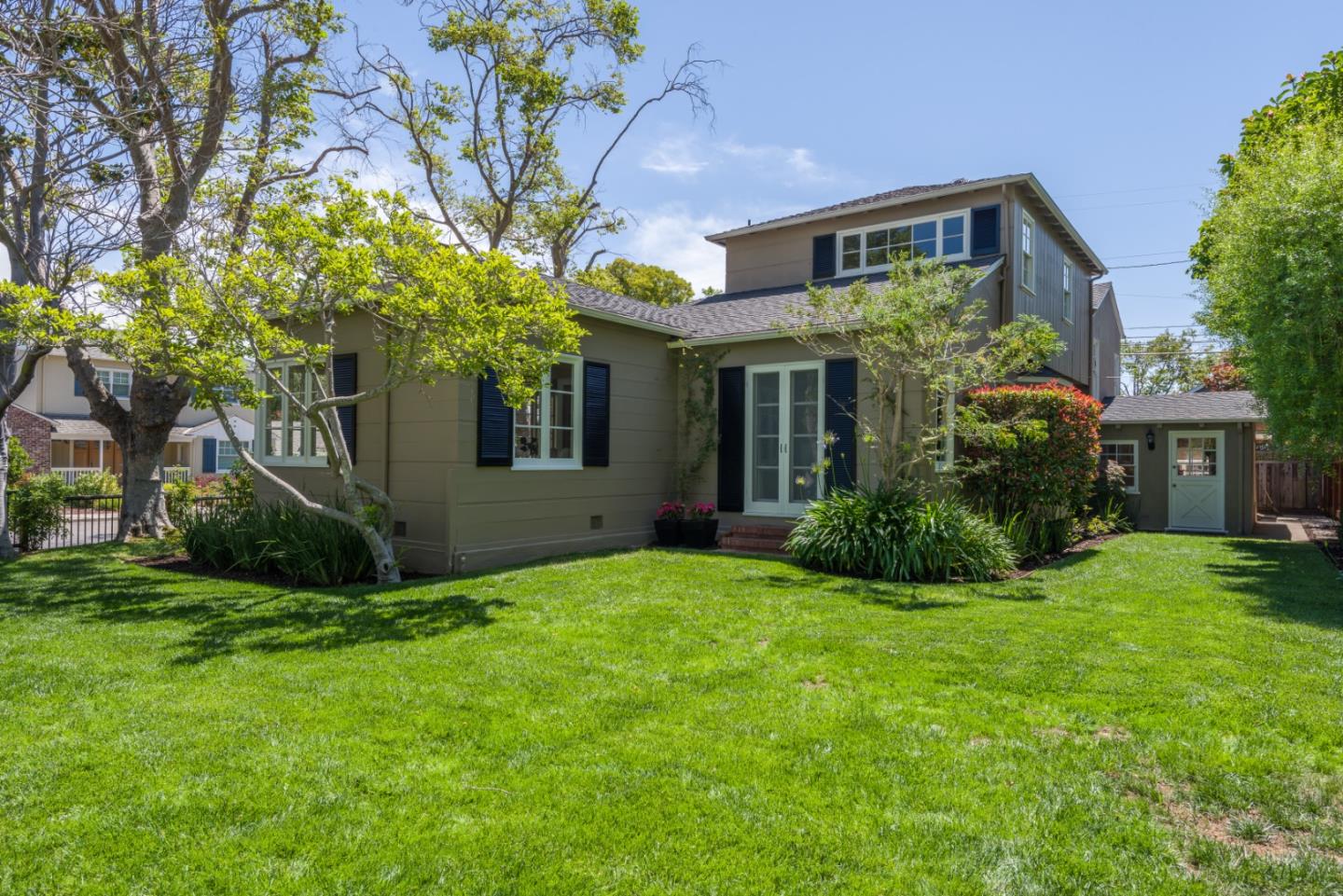1000 Harvard Road San Mateo, CA 94402 - Photo 31 of 32 a view of a brick house with a big yard and large trees
