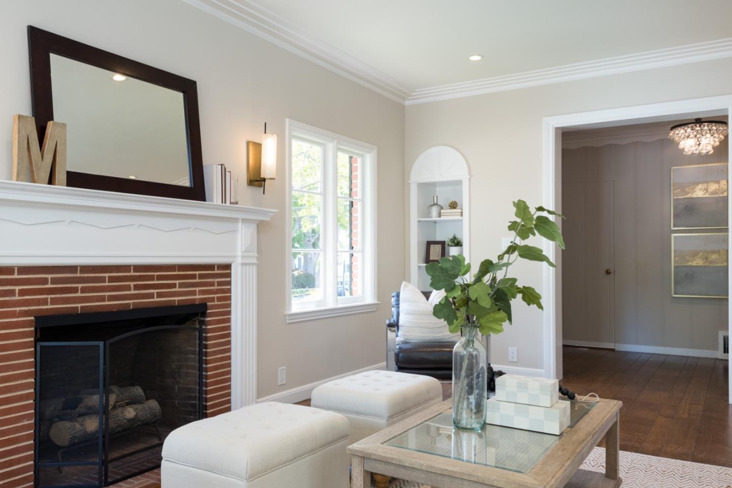1000 Harvard Road San Mateo, CA 94402 - Photo 6 of 32 a living room with furniture a potted plant and a fireplace