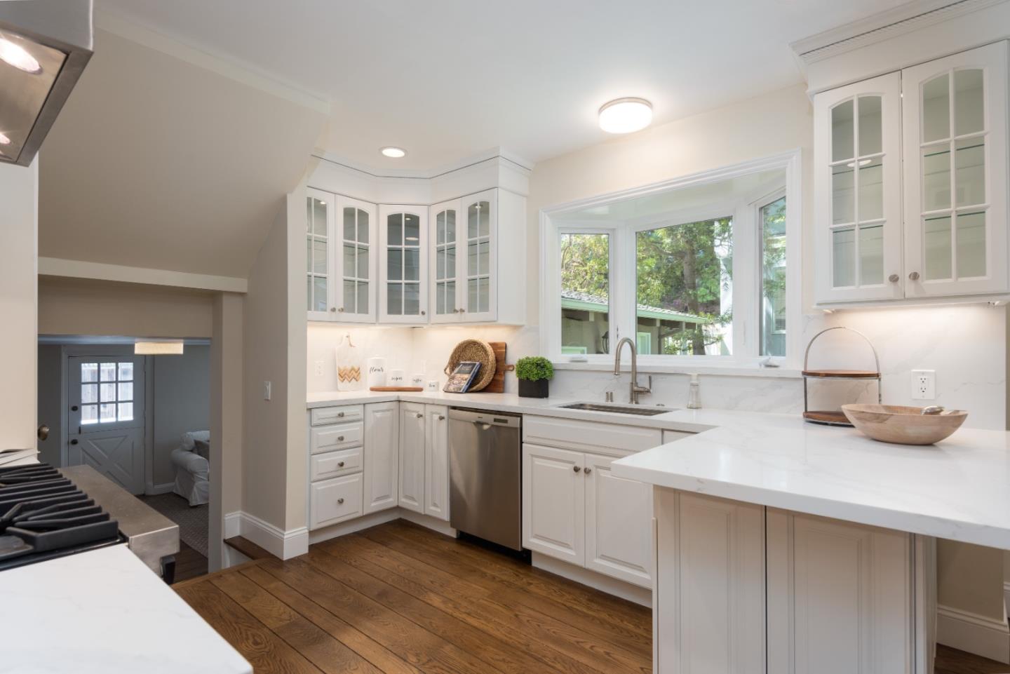1000 Harvard Road San Mateo, CA 94402 - Photo 8 of 32 a kitchen with a sink stove and cabinets