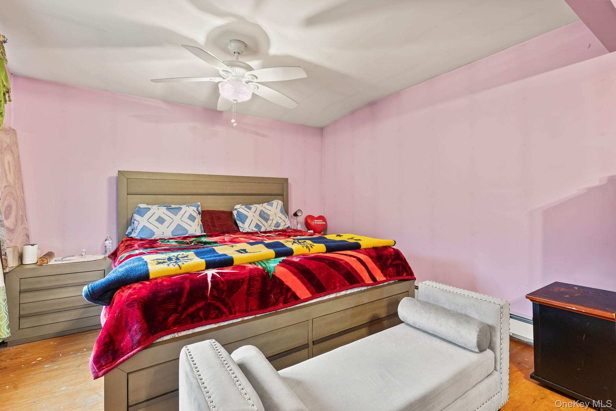 11 Cross Creek Road Cold Spring, NY 10516 - Photo 21 of 43 Bedroom with a ceiling fan, baseboard heating, and light wood finished floors