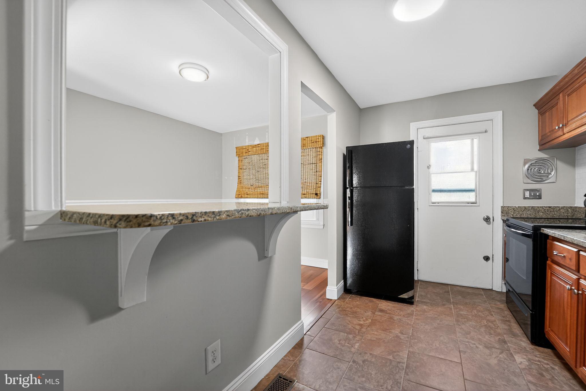 14 Pickens Court Baltimore, MD 21236 - Photo 11 of 30 a view of a kitchen with refrigerator and window