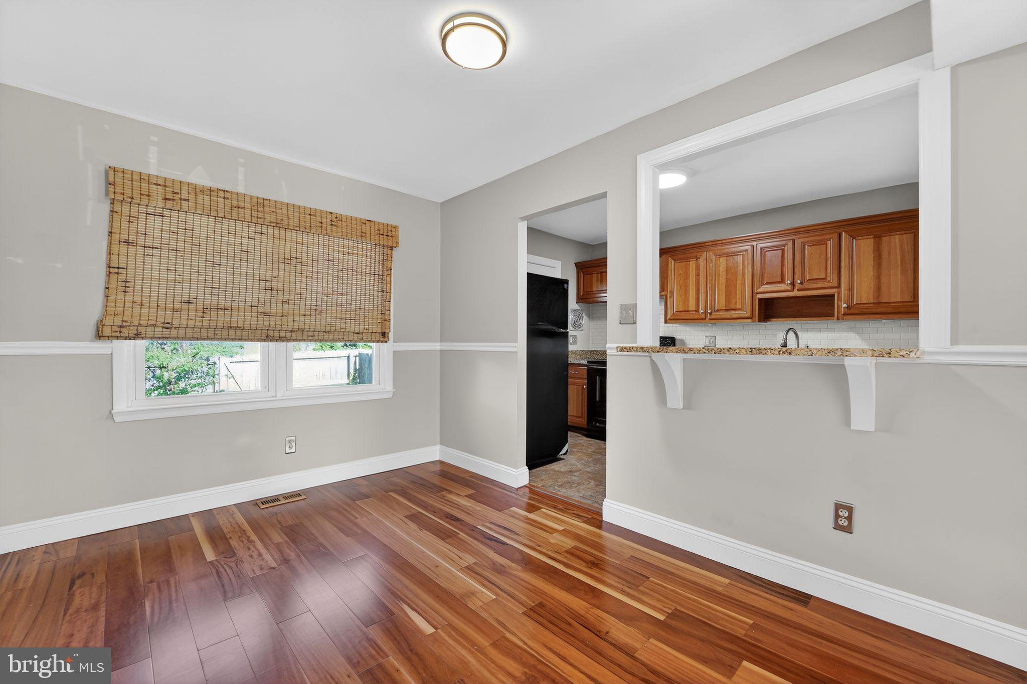 14 Pickens Court Baltimore, MD 21236 - Photo 12 of 30 a view of kitchen with wooden floor and window
