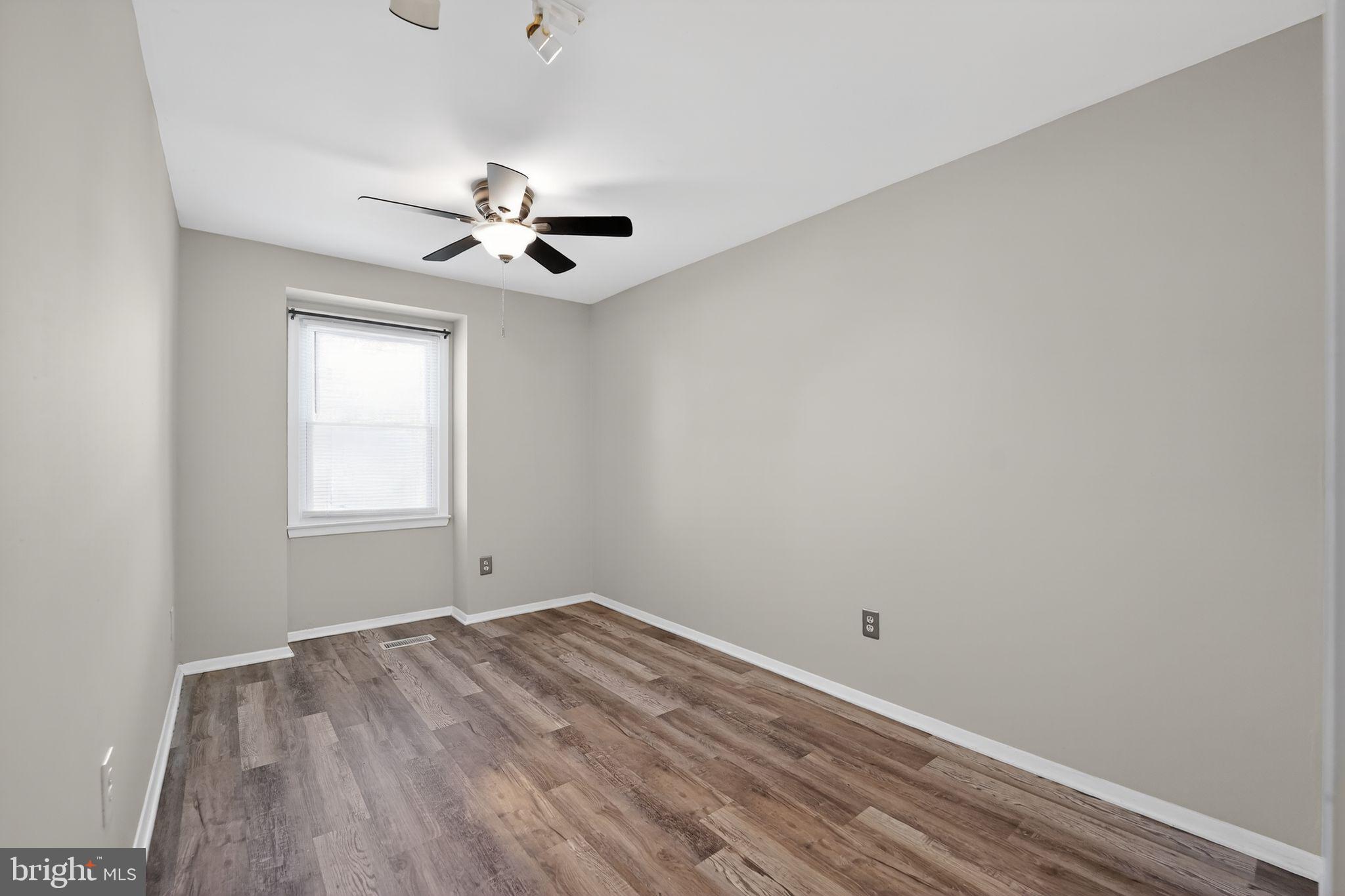 14 Pickens Court Baltimore, MD 21236 - Photo 16 of 30 wooden floor in an empty room with a window