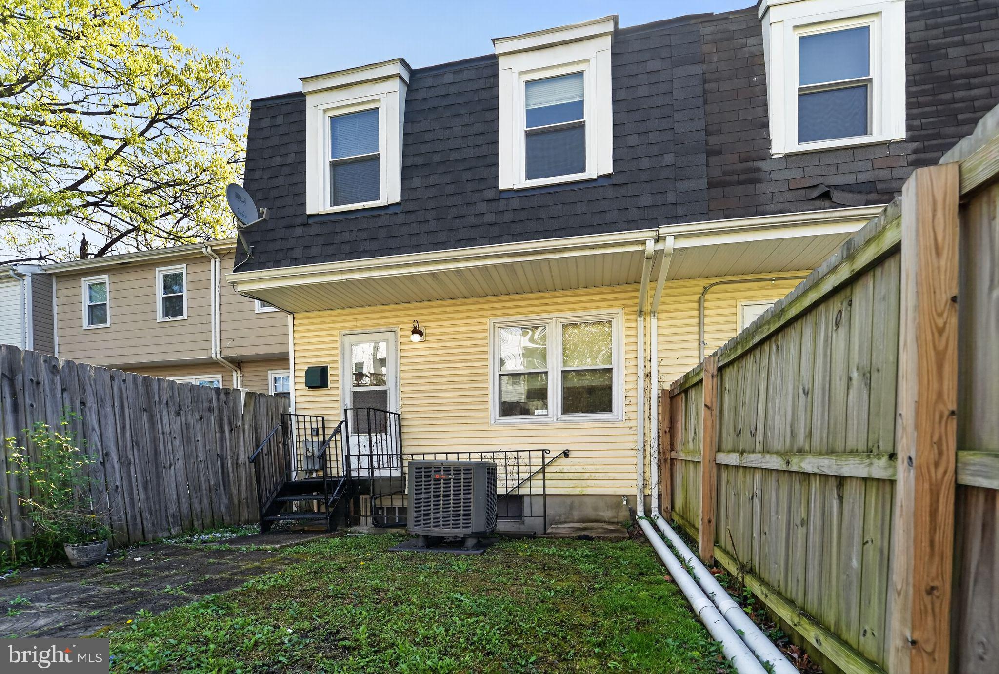 14 Pickens Court Baltimore, MD 21236 - Photo 30 of 30 a view of a house with wooden fence and a yard