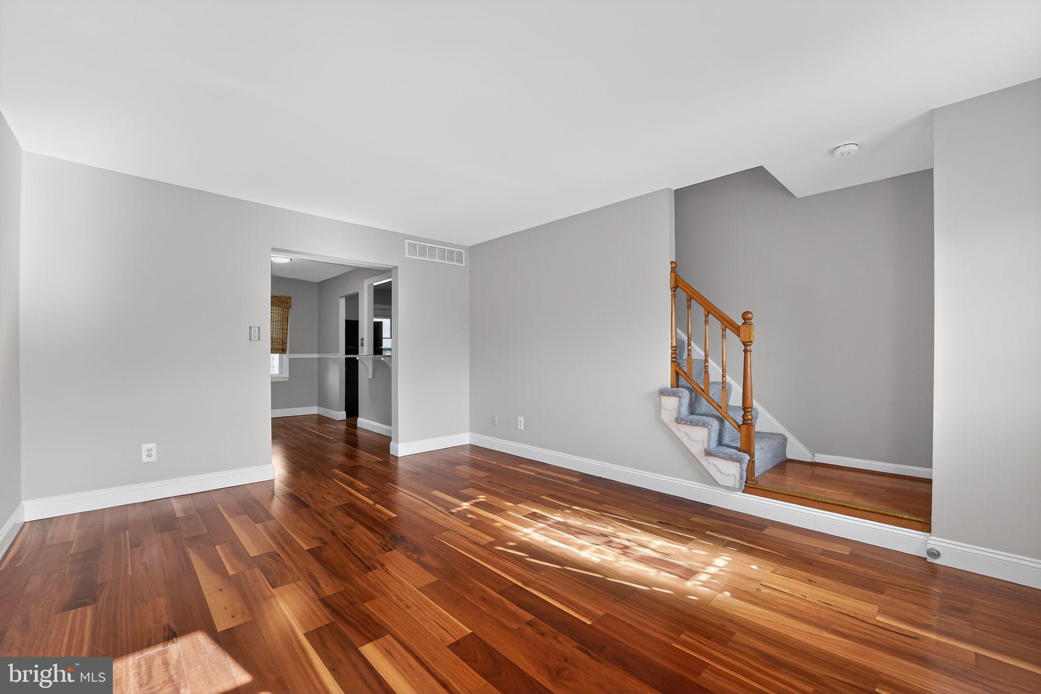 14 Pickens Court Baltimore, MD 21236 - Photo 4 of 30 a view of empty room with wooden floor