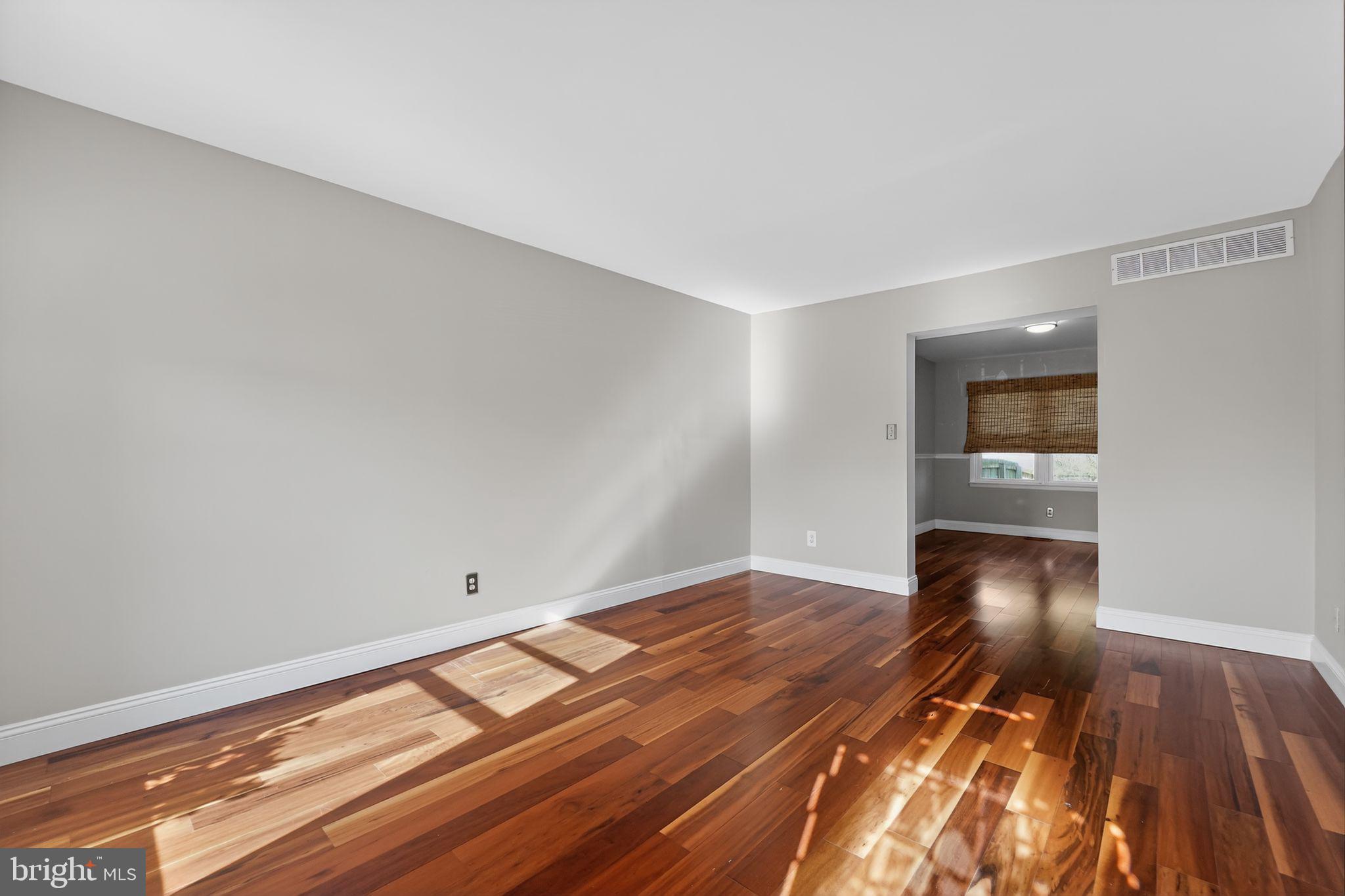14 Pickens Court Baltimore, MD 21236 - Photo 5 of 30 a view of empty room with wooden floor