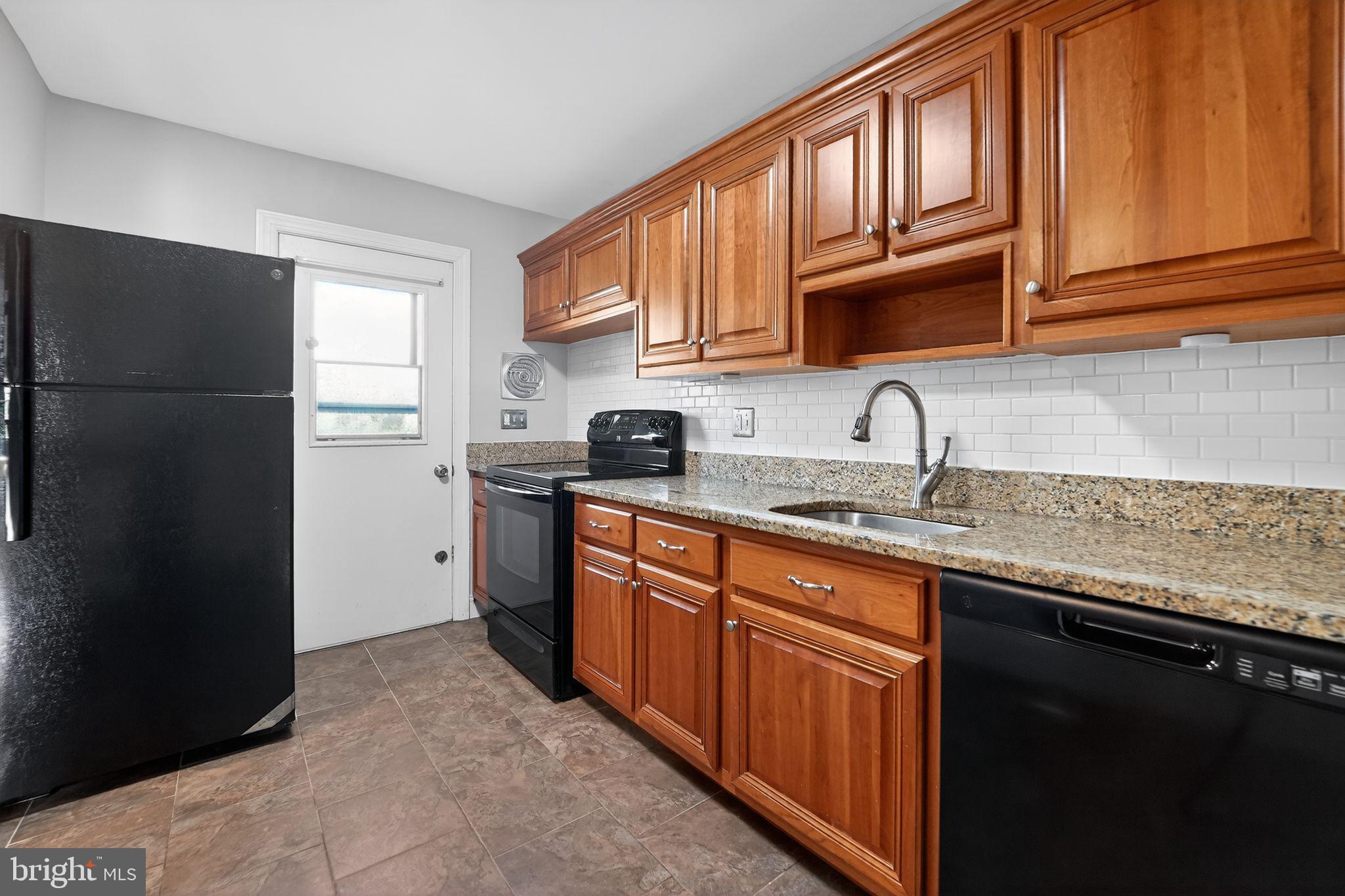 14 Pickens Court Baltimore, MD 21236 - Photo 10 of 30 a kitchen with stainless steel appliances granite countertop a refrigerator and a sink