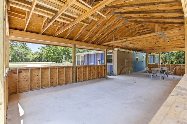 a view of an empty room with windows