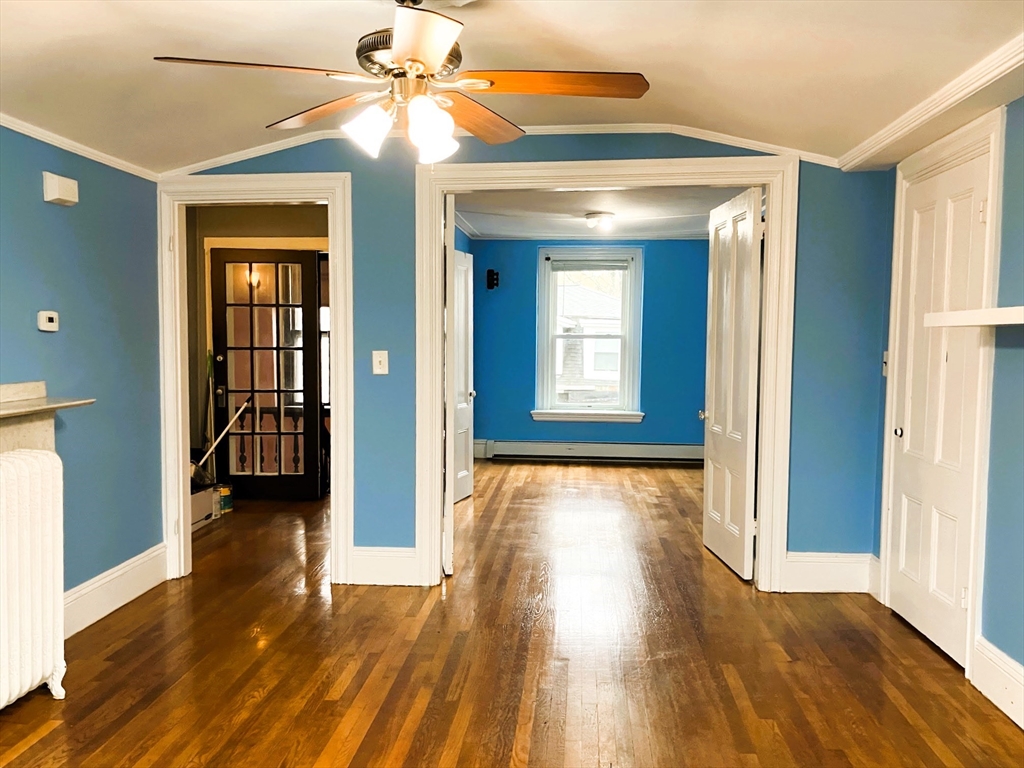 66 Maple Street, Unit 3 Boston, MA 02136 - Photo 4 of 14 a view of livingroom with hardwood floor and hallway