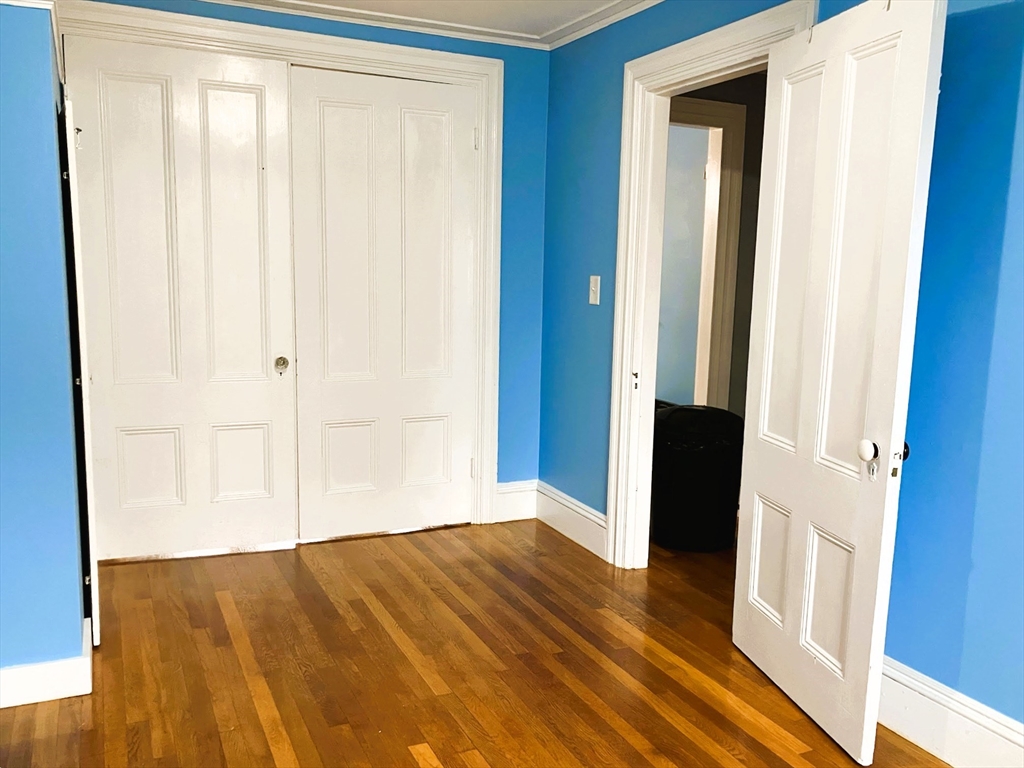 66 Maple Street, Unit 3 Boston, MA 02136 - Photo 7 of 14 a view of front door with wooden floor