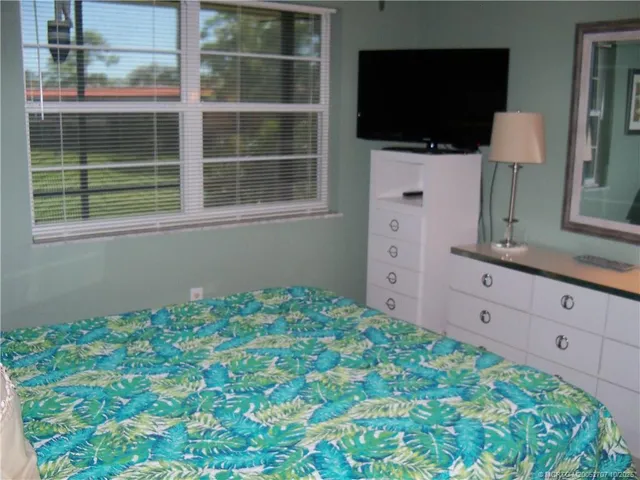 a bed room with a bed and a lamp