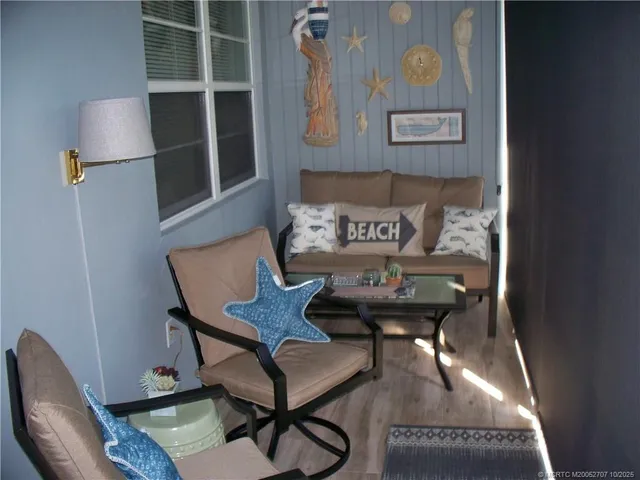 a view of a hallway with seating area