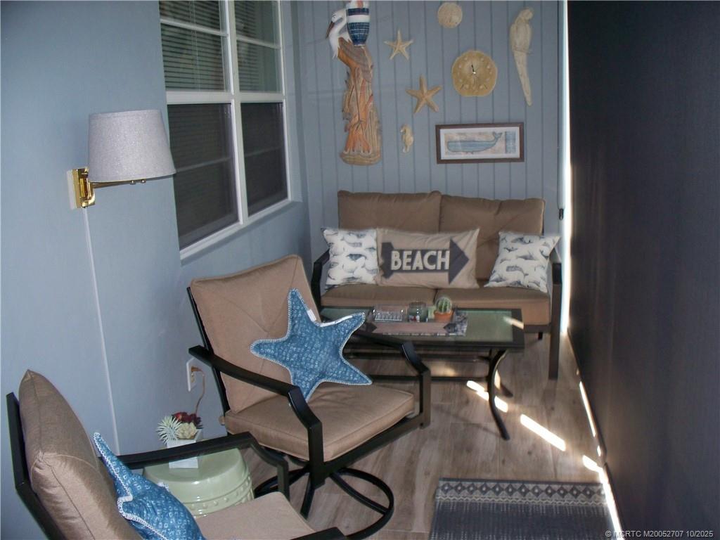 1939 Southwest Palm City Road, Unit G Stuart, FL 34994 - Photo 20 of 34 a living room with furniture
