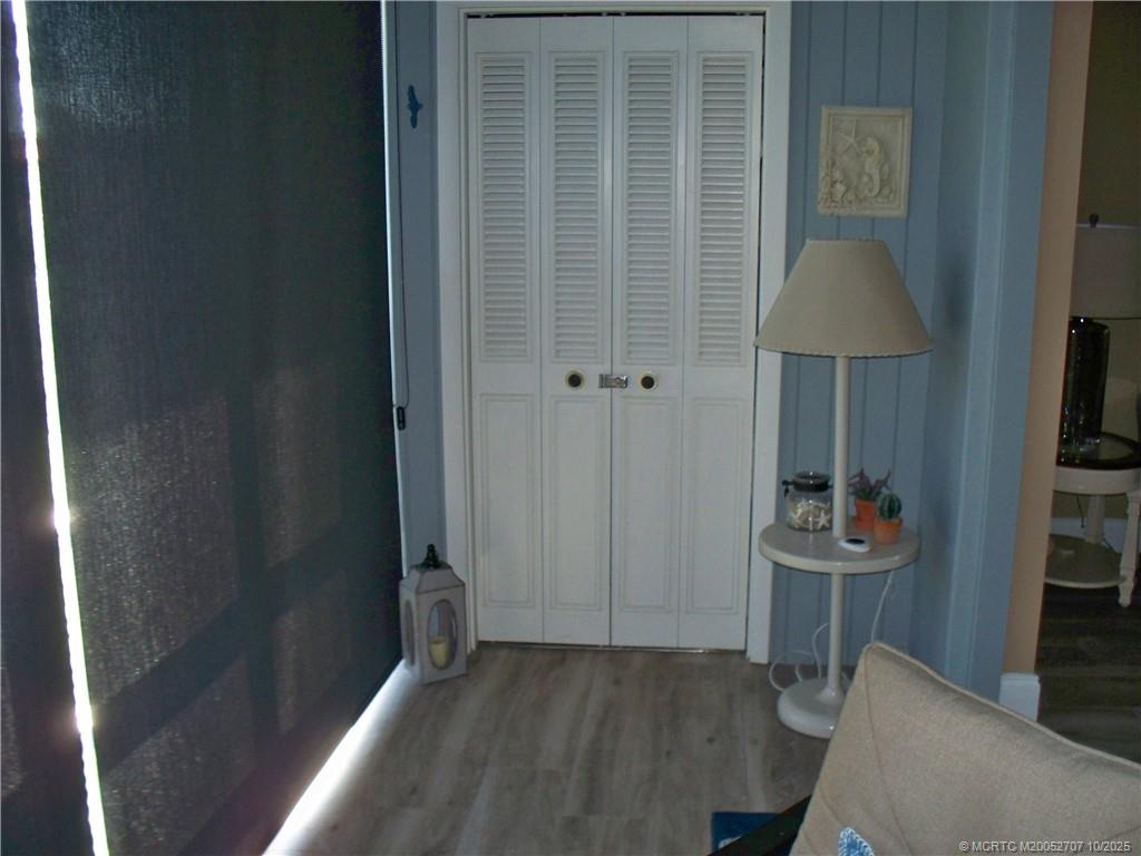 1939 Southwest Palm City Road, Unit G Stuart, FL 34994 - Photo 21 of 34 a view of a hallway with seating area