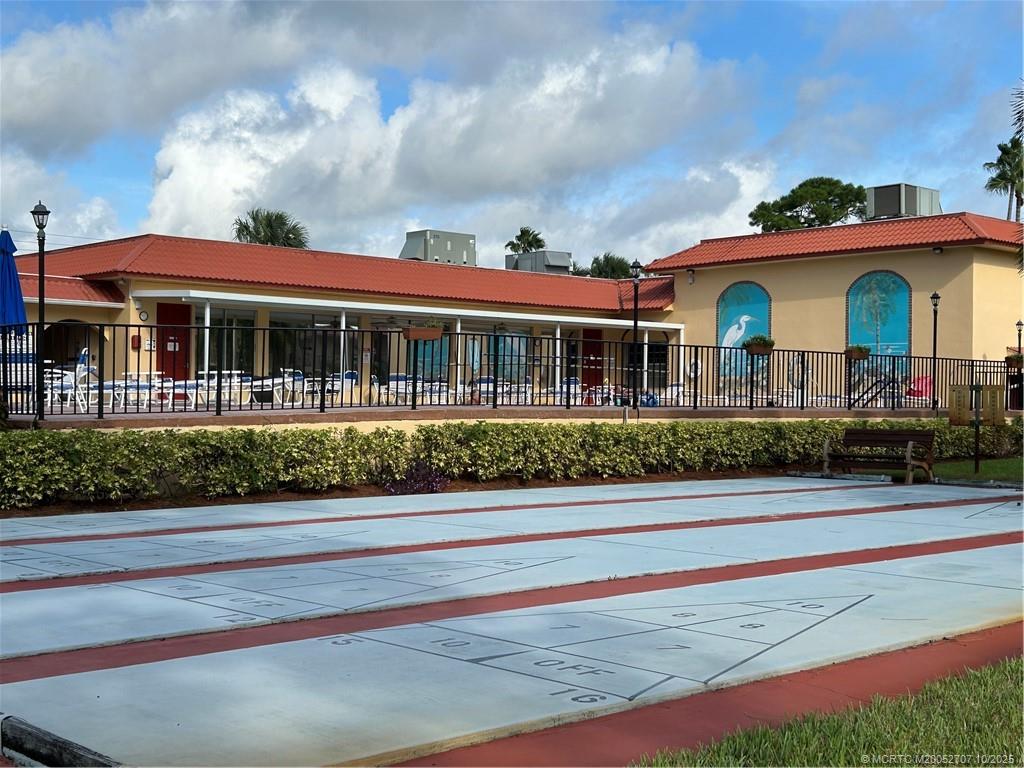 1939 Southwest Palm City Road, Unit G Stuart, FL 34994 - Photo 33 of 34 a front view of a house with a porch