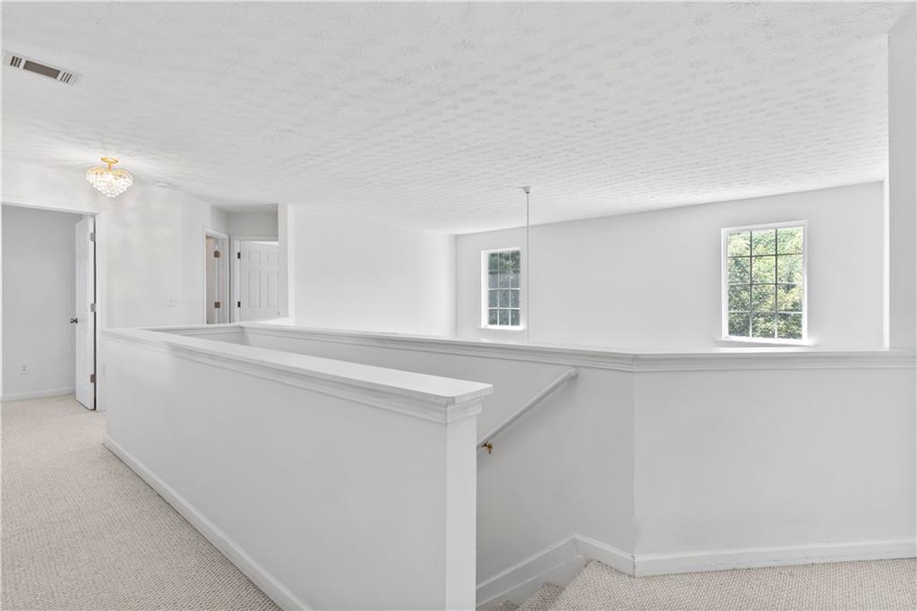 665 Roxford Lane Northeast Buford, GA 30518 - Photo 13 of 19 a bathroom with a sink and a mirror