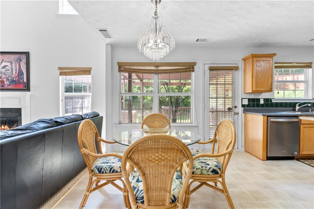 665 Roxford Lane Northeast Buford, GA 30518 - Photo 4 of 19 a view of a dining room with furniture window and outside view