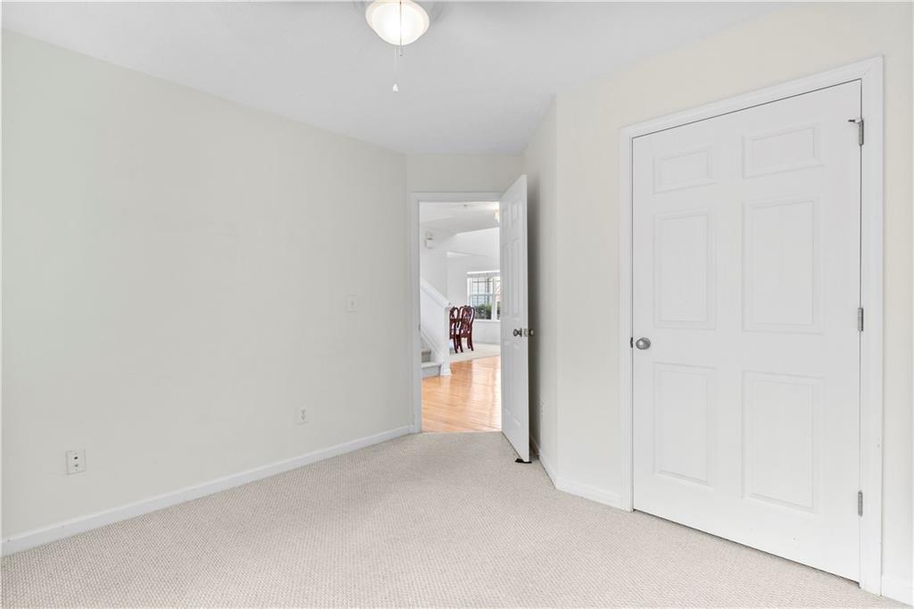 665 Roxford Lane Northeast Buford, GA 30518 - Photo 5 of 19 a view of a room with wooden floor