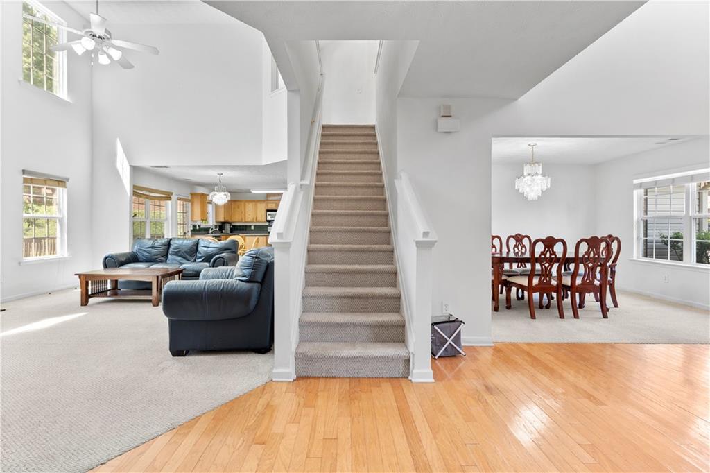 665 Roxford Lane Northeast Buford, GA 30518 - Photo 7 of 19 a bedroom with furniture and a wooden floor
