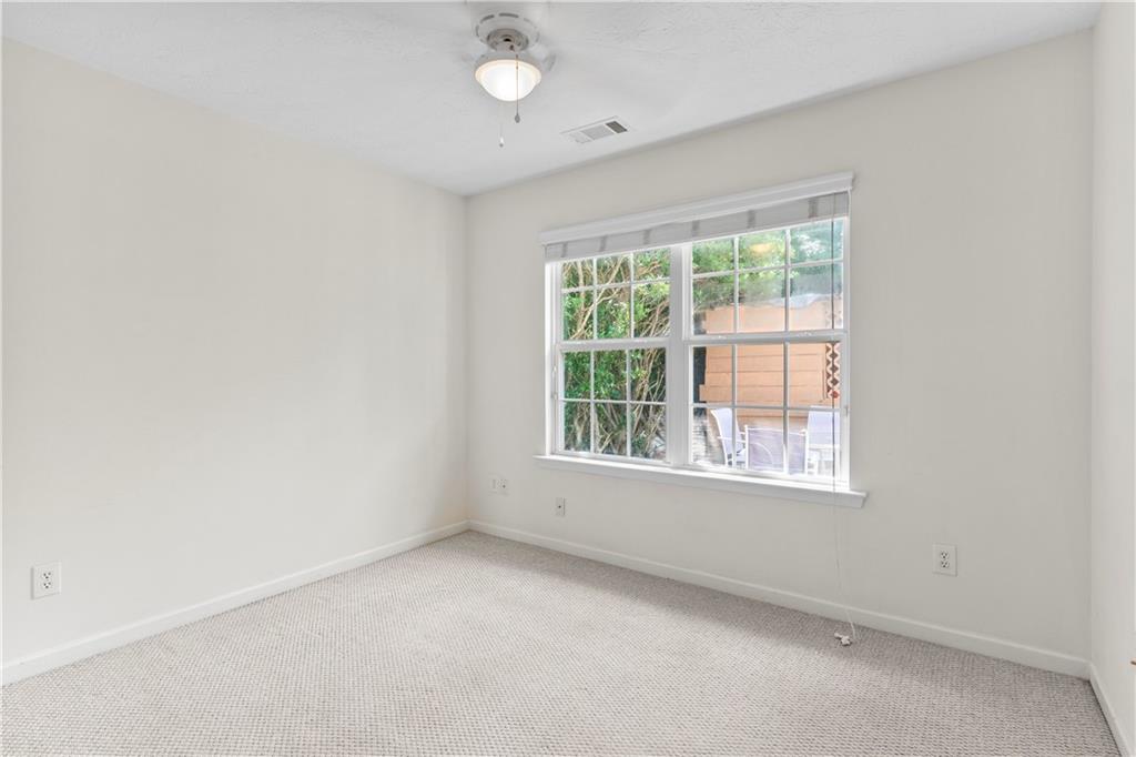 665 Roxford Lane Northeast Buford, GA 30518 - Photo 9 of 19 an empty room with a window