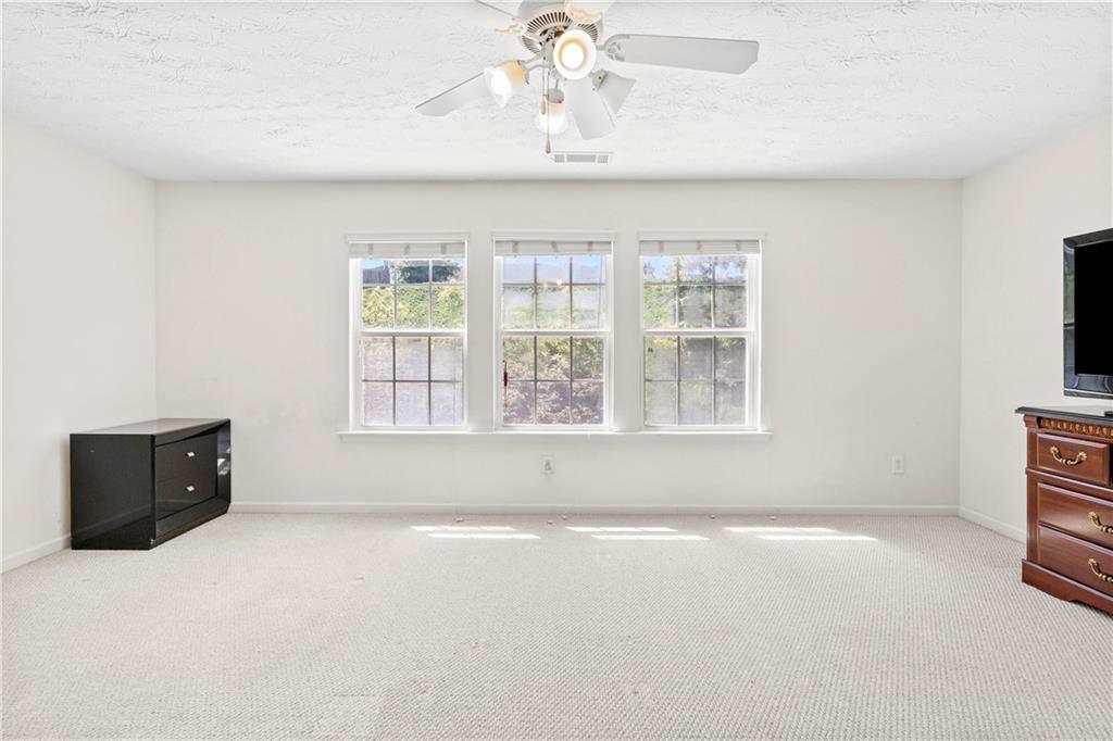 665 Roxford Lane Northeast Buford, GA 30518 - Photo 10 of 19 a view of an empty room with a window