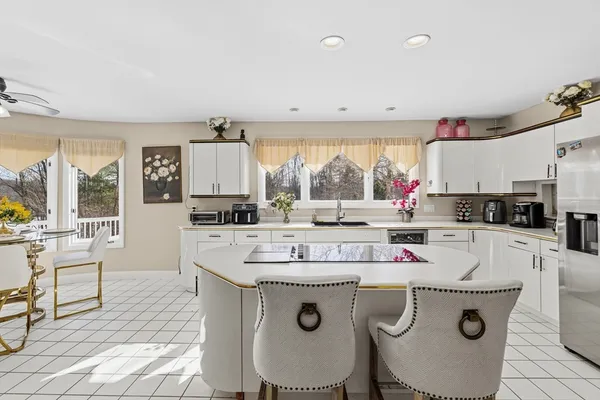 a kitchen with sink cabinets and stove