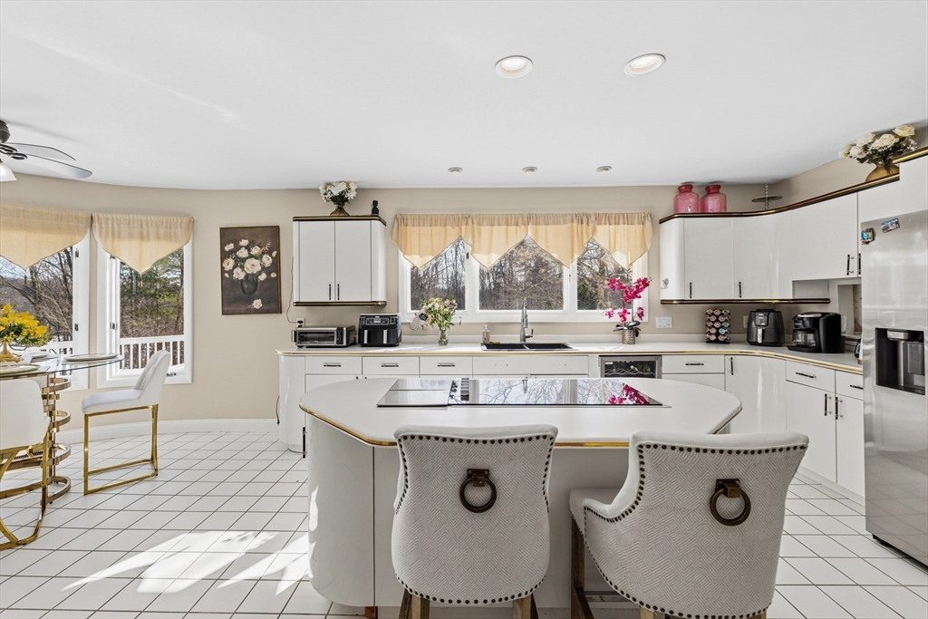 95 Ramshorn Road Dudley, MA 01571 - Photo 11 of 42 a kitchen with a stove a sink and a refrigerator