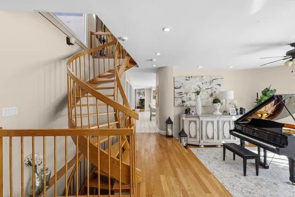 a living room with furniture large window and flat screen tv