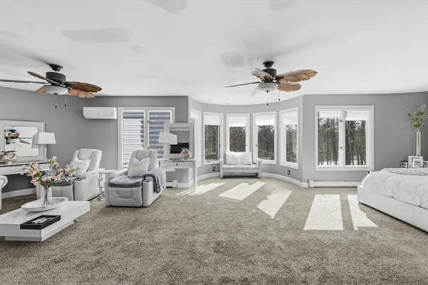 a bedroom with a bed and a lamp on table