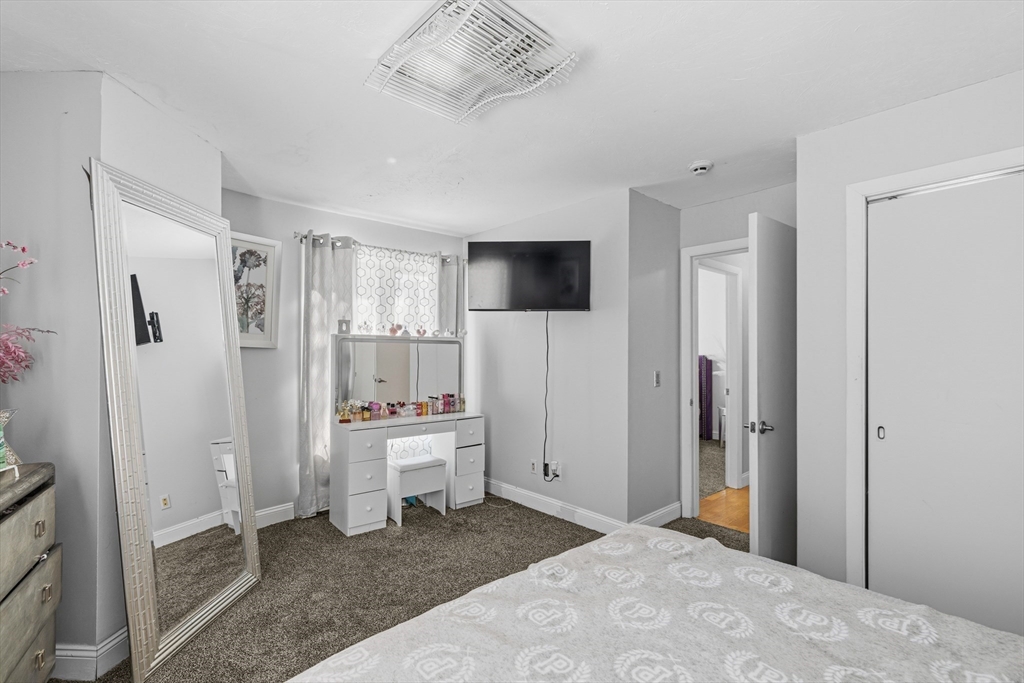 95 Ramshorn Road Dudley, MA 01571 - Photo 28 of 42 a room with a bed and a television