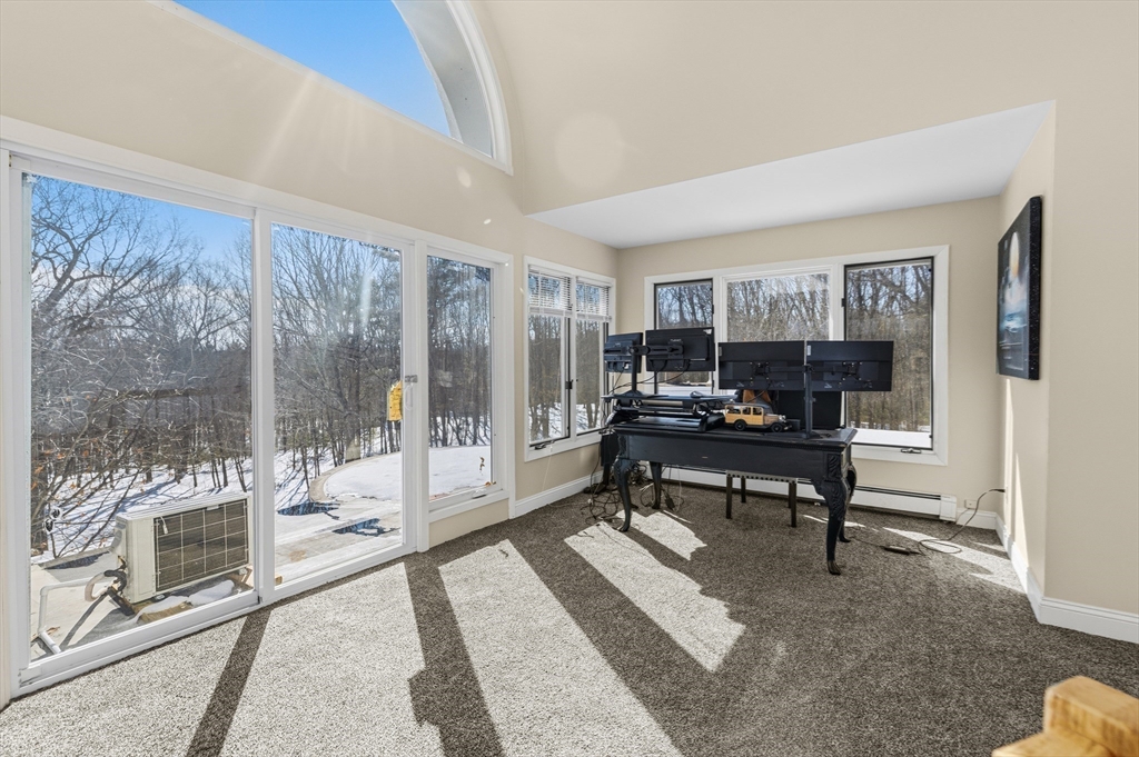 95 Ramshorn Road Dudley, MA 01571 - Photo 32 of 42 a view of a livingroom with workspace and a window
