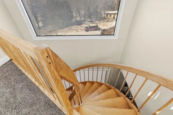 a very nice looking room with a large mirror and furniture