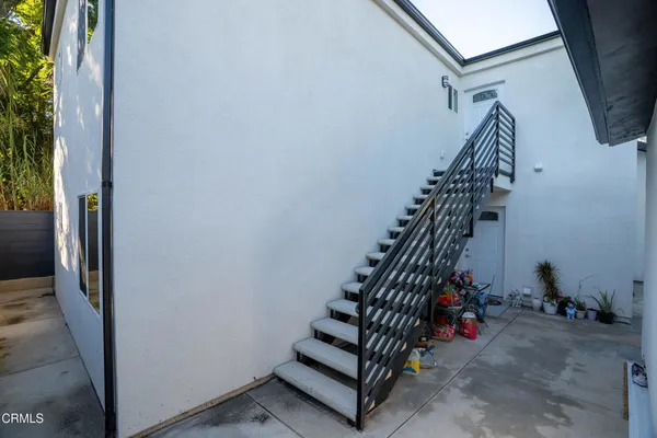 an aerial view of house with swimming pool