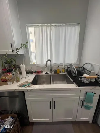 a kitchen with a sink and a cabinets