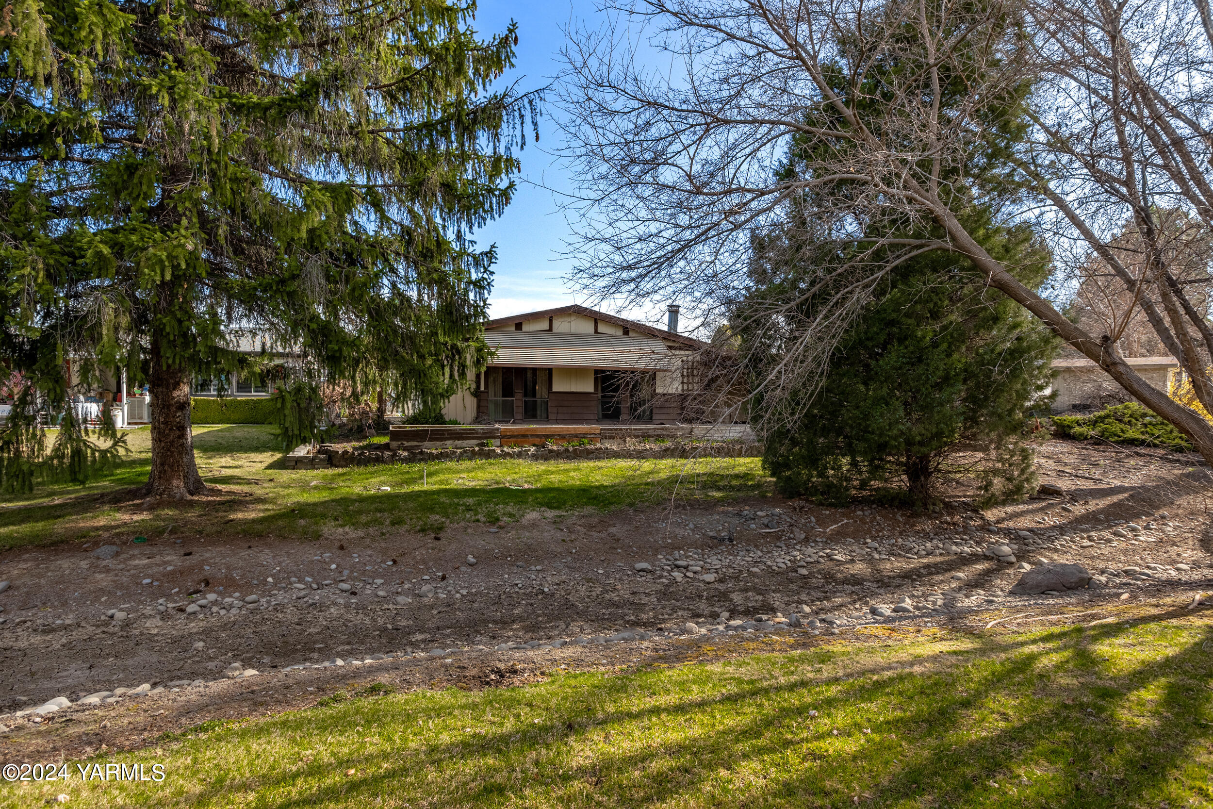 3701 Gun Club Road, Unit 28 Yakima, WA 98901 - Photo 1 of 28 a view of house with a backyard