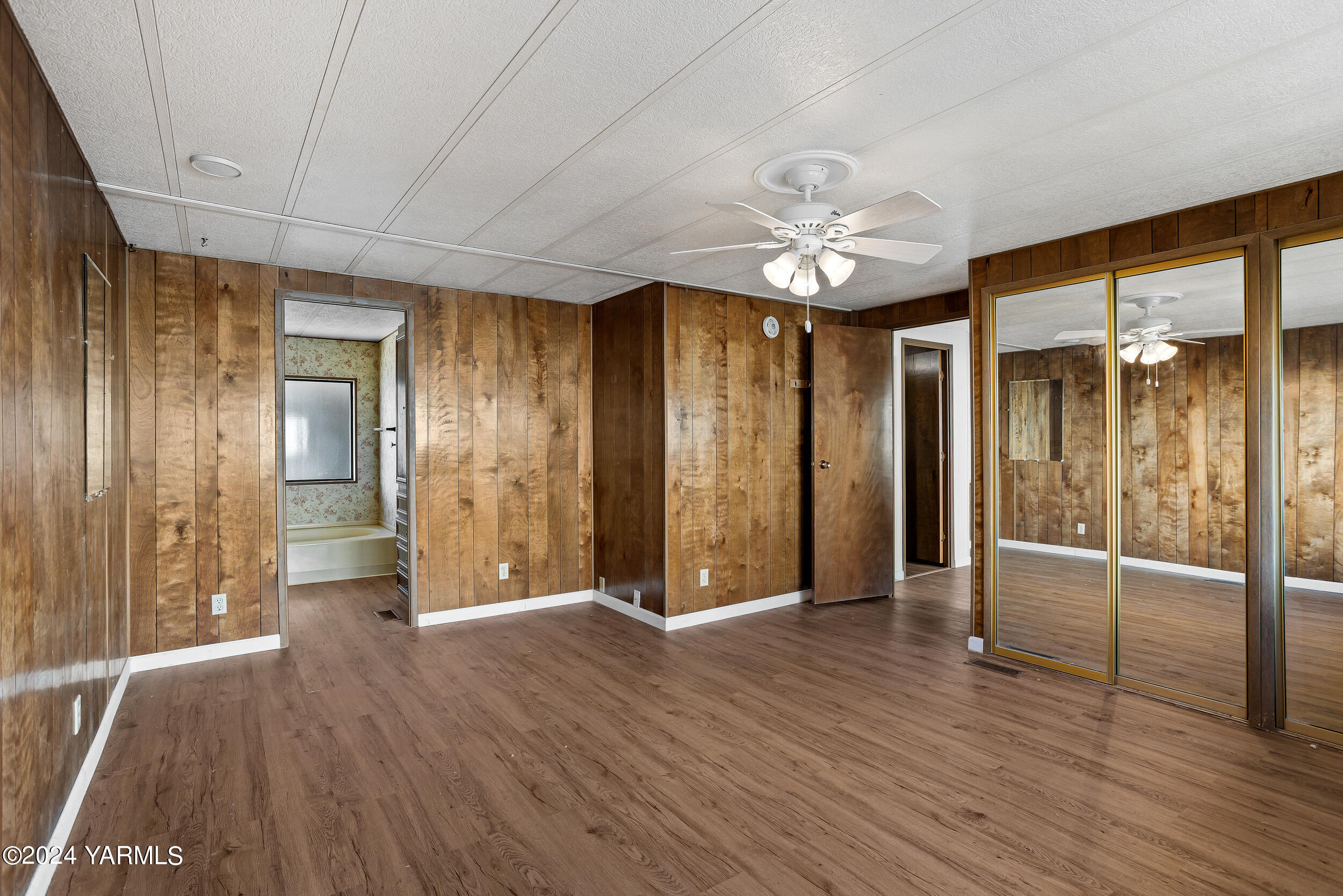 3701 Gun Club Road, Unit 28 Yakima, WA 98901 - Photo 12 of 28 wooden floor in an empty room with a window